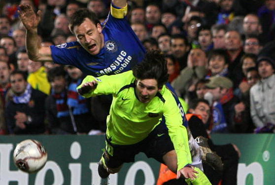 Chelsea's John Terry (L) dives over the